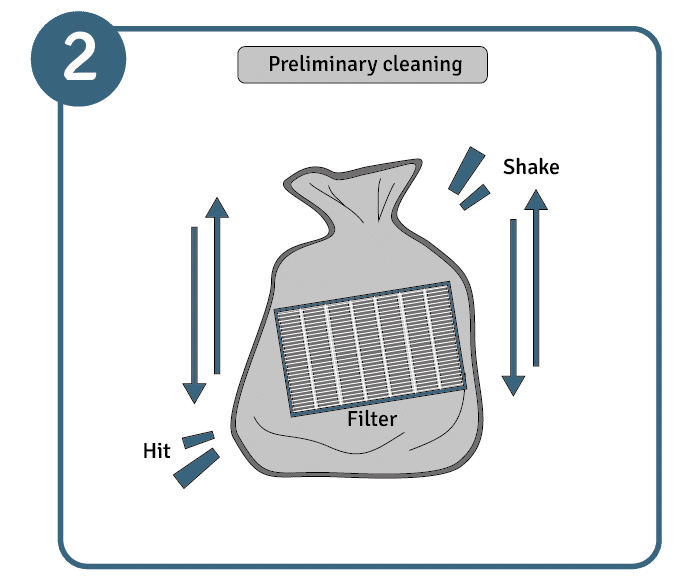 A picture of the HEPA filter bag being hit and shook to indicate preliminary cleaning methods